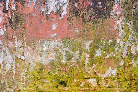 Old rusted wall with peeling paintの写真素材