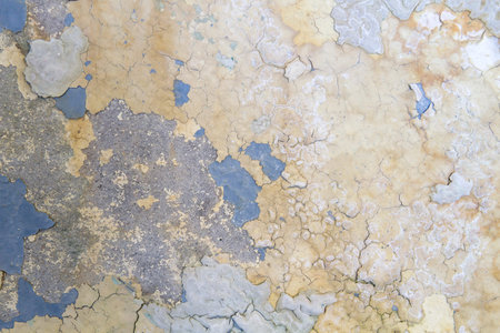 Old colored wall with peeling paint