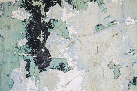 Old wall with peeling paint background.