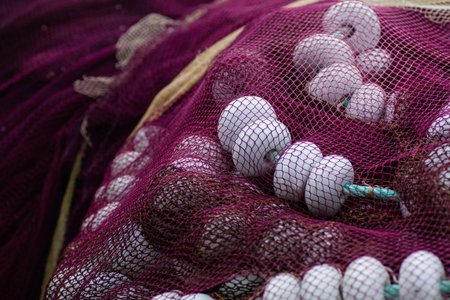 Old fishing nets pile with nets and floats