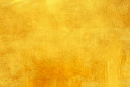 Ochre yellow painting backdrop grunge background or textureの写真素材