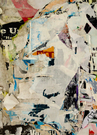 Old bulletin board with rests of wallpapers, grunge background or texture