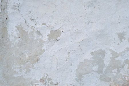Old whitewashed lime wall, grunge background or textureの写真素材