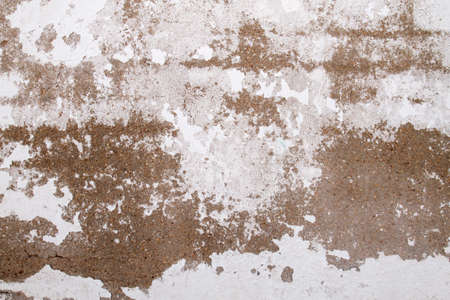 Old peeling whitewashed lime wall, grunge background or textureの写真素材