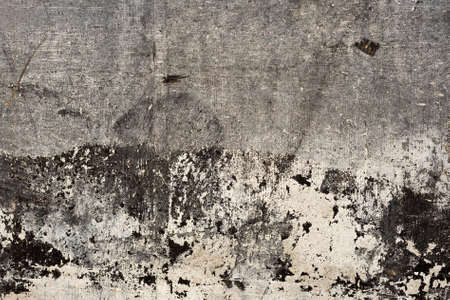 Old worn out concrete wall grunge bakcground or textureの写真素材