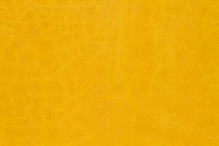 Yellow painted concrete wall texture or backgroundの写真素材