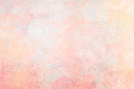 Old distressed pastel pink colored backdrop with scratches worn out grunge background or textureの写真素材