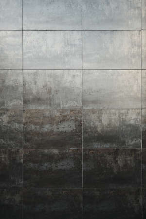 Modern distressed tiled wall with oxidized effect and textureの写真素材