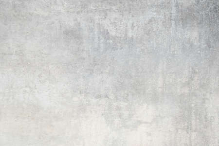 White distressed wall, worn out rusted metal texture grunge backgroundの写真素材