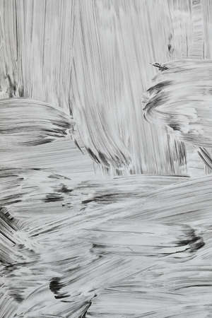 White paint strokes on a shop window, abstract background or textureの写真素材