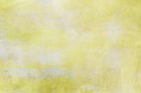 Yellow abstract painting on canvas grunge background or textureの写真素材