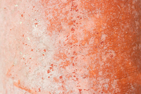 Old distressed terracota clay pottery vessel detail, worn out background or textureの写真素材