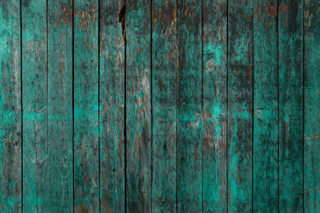 Worn out green painted wooden planks wall rustic backdrop wood textureの写真素材