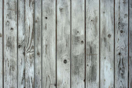 Old weathered white painted rustic wooden planks wall background, distressed wood textureの写真素材