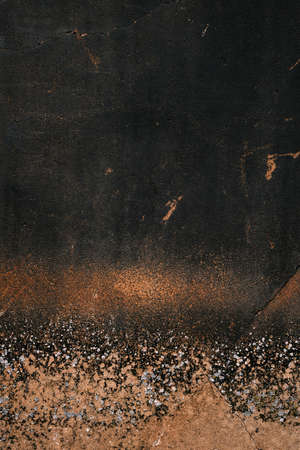Black plastered wall with damp and mould, grunge background or textureの写真素材