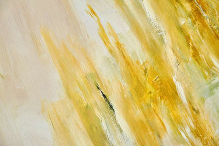 Yellow brush strokes on white backdrop abstract painting on canvas background with textureの写真素材