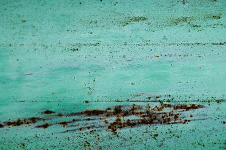 Turquoise painted rusted metal sheet, grunge background or textureの写真素材