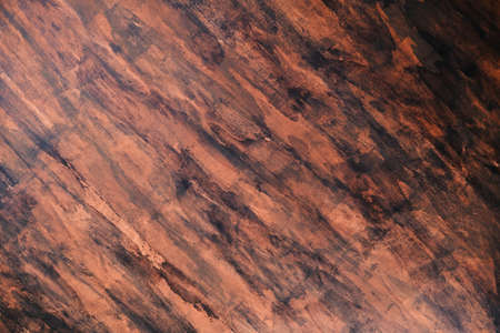 Brown and black grungy painted stucco wall backgroundの写真素材