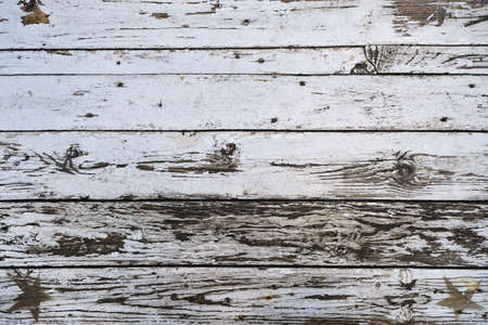Old worn out wooden planks with white peeling paint and stars decoration, distressed rustic grungy background or textureの写真素材