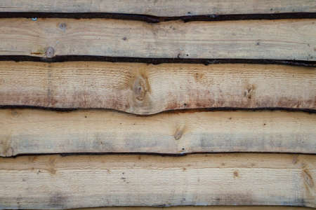 Old rustic wooden logs wallの写真素材
