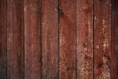 Worn out red painted wooden planks wall, rustic distressed background or textureの写真素材