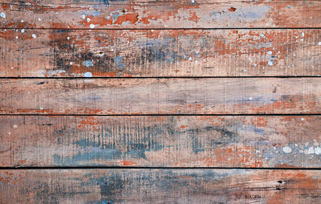 Old worn out blue and red painted rustic wooden planks wall, distressed  background or textureの写真素材