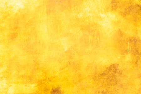 Ochre yellow painting backdrop grunge background or textureの写真素材