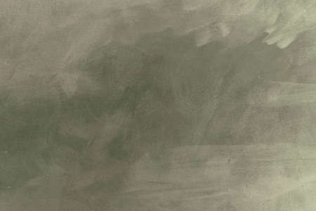 Pale gray green stucco wall grunge background or textureの写真素材