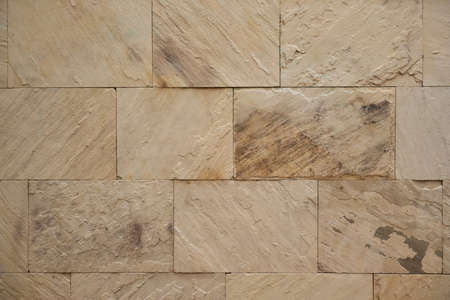 Ceramic porcelain stoneware tiles wall with textured natural sandstone finishの写真素材