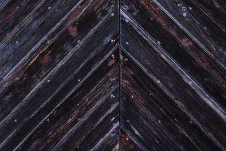 Old rustic wooden wall with diagonal planksの写真素材