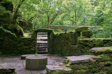 Ancient water mill mossy ruins in Fragas do Eume natural park, Galicia, Spainの写真素材