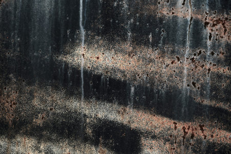 Worn out black painted corroded metal grunge texture