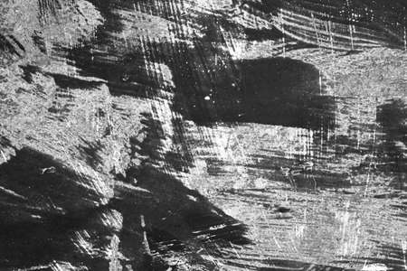 Black and white distressed metal sheet grunge backgroundの写真素材