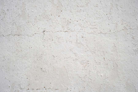 Old distressed traditional white lime-washed wall texture grunge backgroundの写真素材