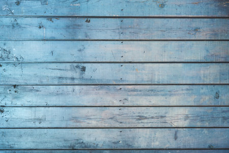 Old blue wooden planks wall backgroundの写真素材