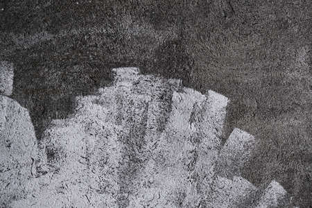 Concrete wall with lime wash white strokes, grunge background or textureの写真素材