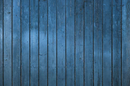 Old blue wooden planks wall backgroundの写真素材