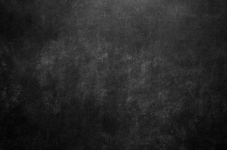 Worn out black board texture grunge backgroundの写真素材