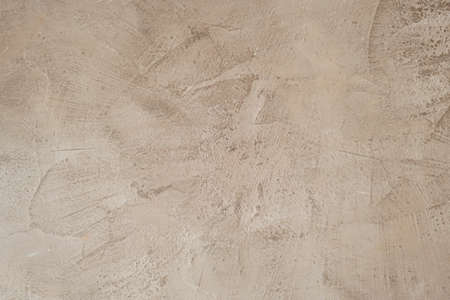Beige colored venetian finish plaster wall grungy textureの写真素材