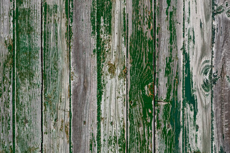 Old distressed wooden wall with worn out green peeling paint, grunge wood backgroundの写真素材