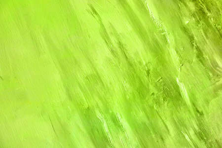 Green lime colored canvas backdrop, abstract painting background or textureの写真素材