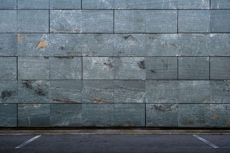 Slate effect porceliain tiles wall cladding in a parking lot , architecture detail backgroundの写真素材