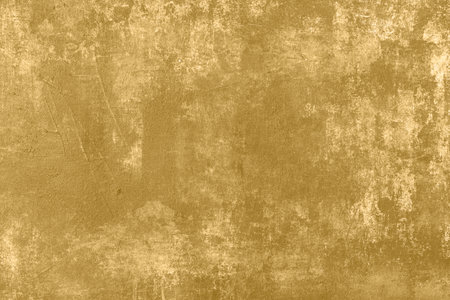 Golden painted stained canvas abstract backgroundの写真素材