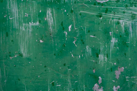 Green painted old metal sheet grunge backgroundの写真素材