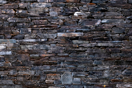 Old traditional slate slabs wall, rustic abstract backgroundの写真素材