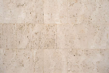 Classic cladding  wall slabs with textured travertine stone finish impressionの写真素材