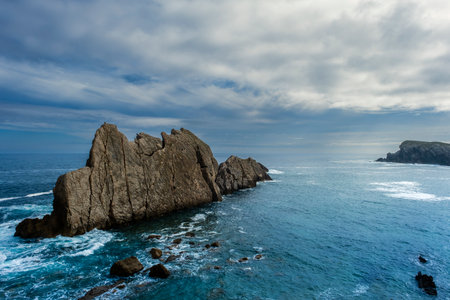 Eroded limestone sea stacks in La Arnia, Costa Quebrada, Cantabria, Spainの写真素材