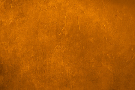 Golden plaster wall grunge backgroundの写真素材
