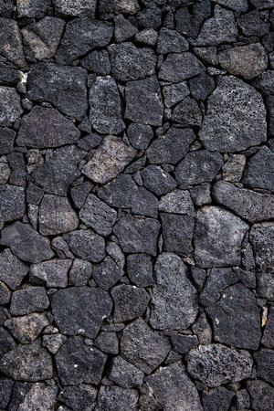 Volcanic rock stonework wall backgroundの写真素材