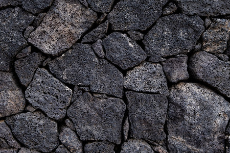 Volcanic rock stonework wall backgroundの写真素材